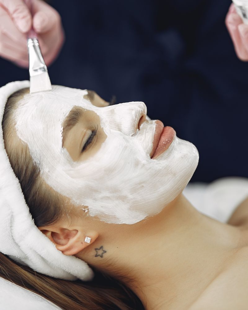 Practitioner performing a customized facial treatment at Veloura Skin Studio